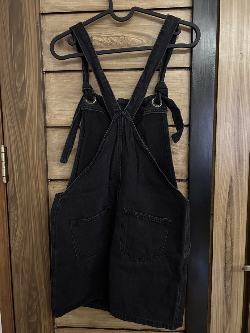 Mango Black Denim Jumper Dress (Category: Dresses) located in Quezon City. Submitted by zen_mollygirl (Listing ID 1445516418, Image 2). Description: - Mango black denim overall dress - Button front closure - Adjustable straps with tie detail - Features pockets - Ideal for casual wear - Versatile: pair with a t-shirt or turtleneck.
