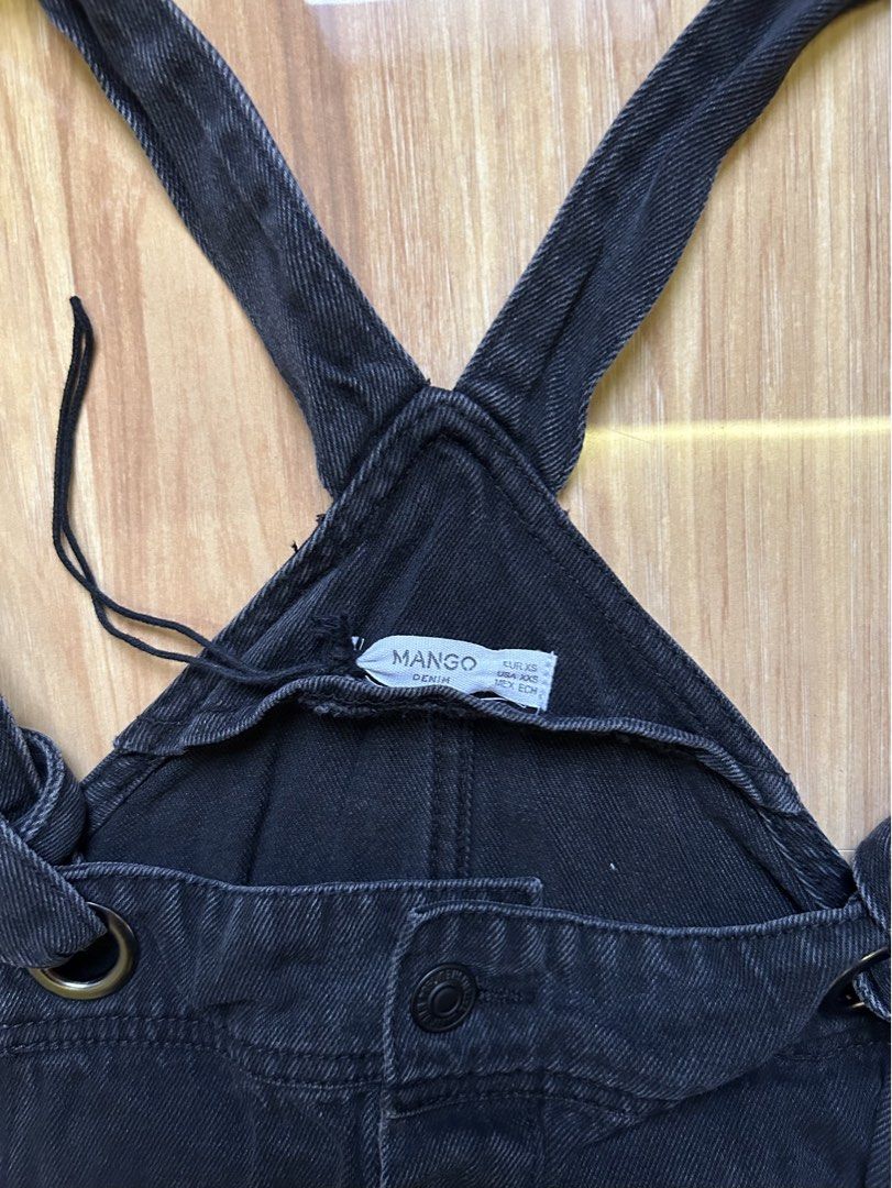 Mango Black Denim Jumper Dress (Category: Dresses) located in Quezon City. Submitted by zen_mollygirl (Listing ID 1445516418, Image 3). Description: - Mango black denim overall dress - Button front closure - Adjustable straps with tie detail - Features pockets - Ideal for casual wear - Versatile: pair with a t-shirt or turtleneck.