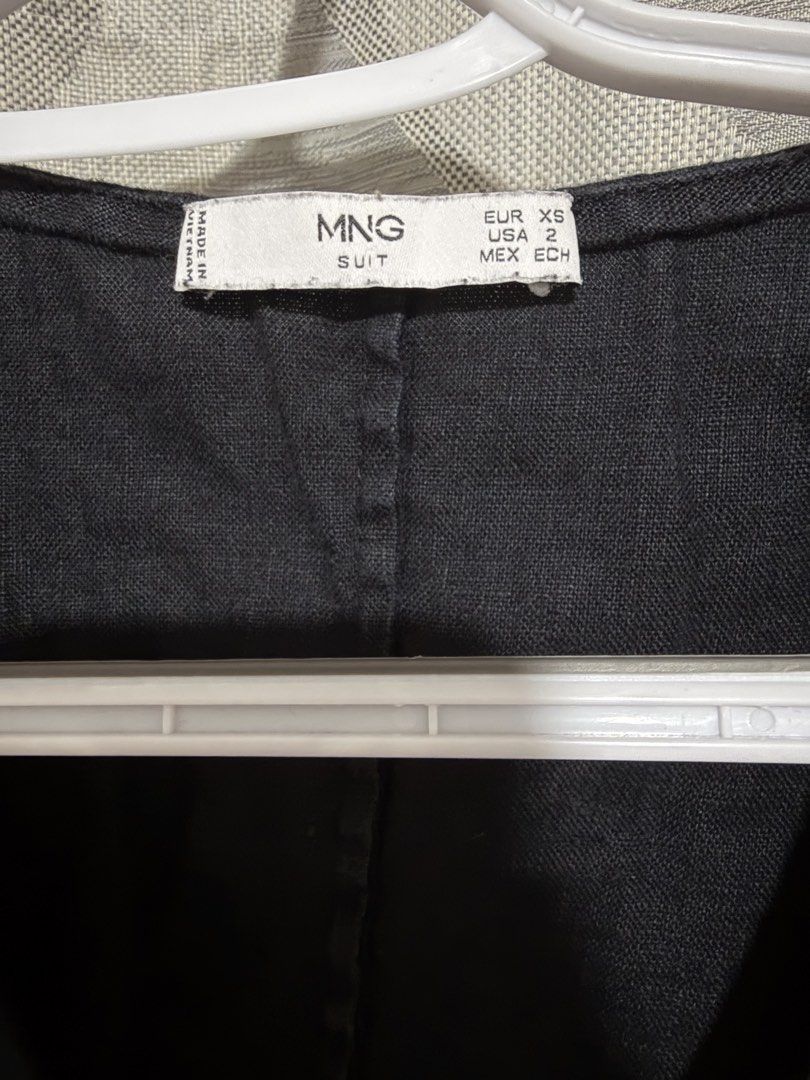 Mango Black Sleeveless Button-Up Mini Dress (Category: Dresses) located in Davao. Submitted by 666declutters (Listing ID 1445603076, Image 2). Description: - Mango black sleeveless dress - Linen fabric - Button-up front detail - V-neckline - Versatile for layering or wearing alone.