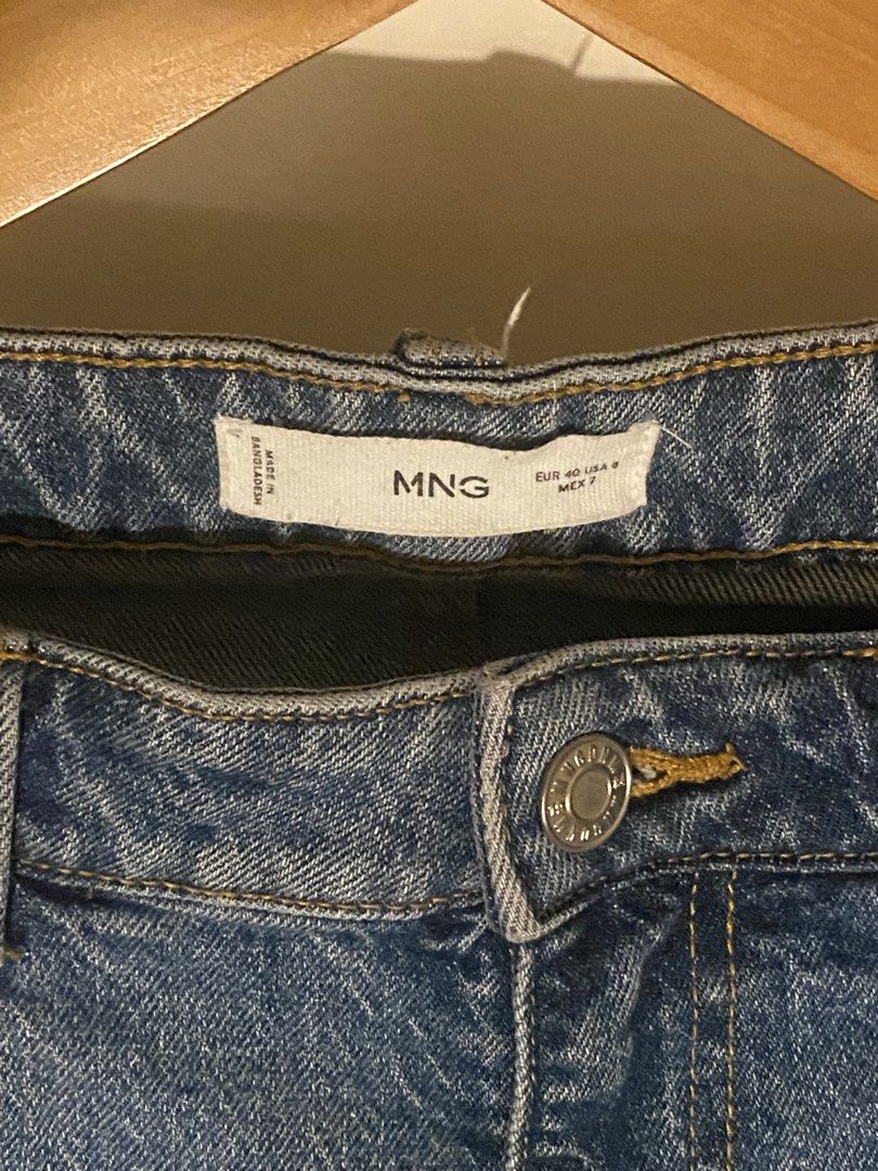 Mango Blue Denim Straight Leg Jeans (Category: Jeans) located in Mandaluyong City. Submitted by matcha.decluttz (Listing ID 1445539048, Image 2). Description: - Brand: Mango - Color: Classic Blue Denim - Fit: Straight Leg - Closure: Button and Zip - Pockets: Front and Back - Style: Versatile staple piece, easy to dress up or down.