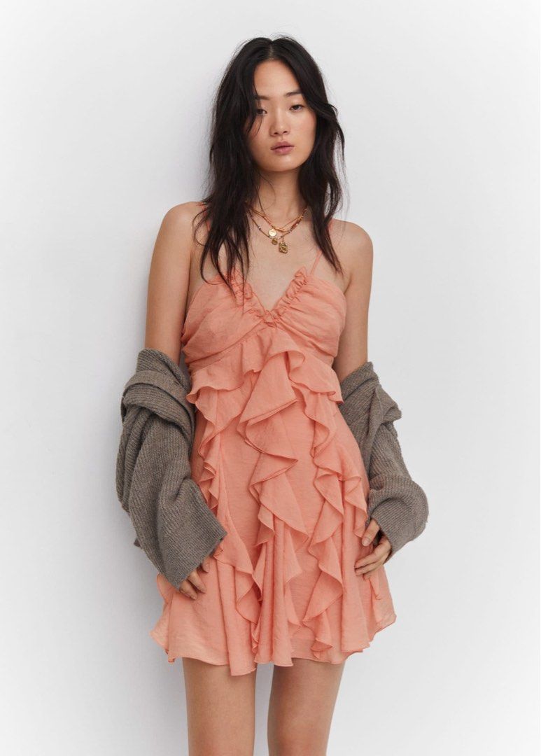 Mango Peach Ruffle Spaghetti Strap Mini Dress (Category: Dresses) located in Quezon City. Submitted by bagelll18 (Listing ID 1445431292, Image 1). Description: For rent: Php 1000 for 4 days + Security Deposit Php 1000 (Refundable) - Adorable peach mini dress - Features multiple ruffles for a playful look - Delicate spaghetti straps - Flattering ruched bust detail - Ideal for summer outings or parties - Flowy and fun silhouette - Versatile styling
