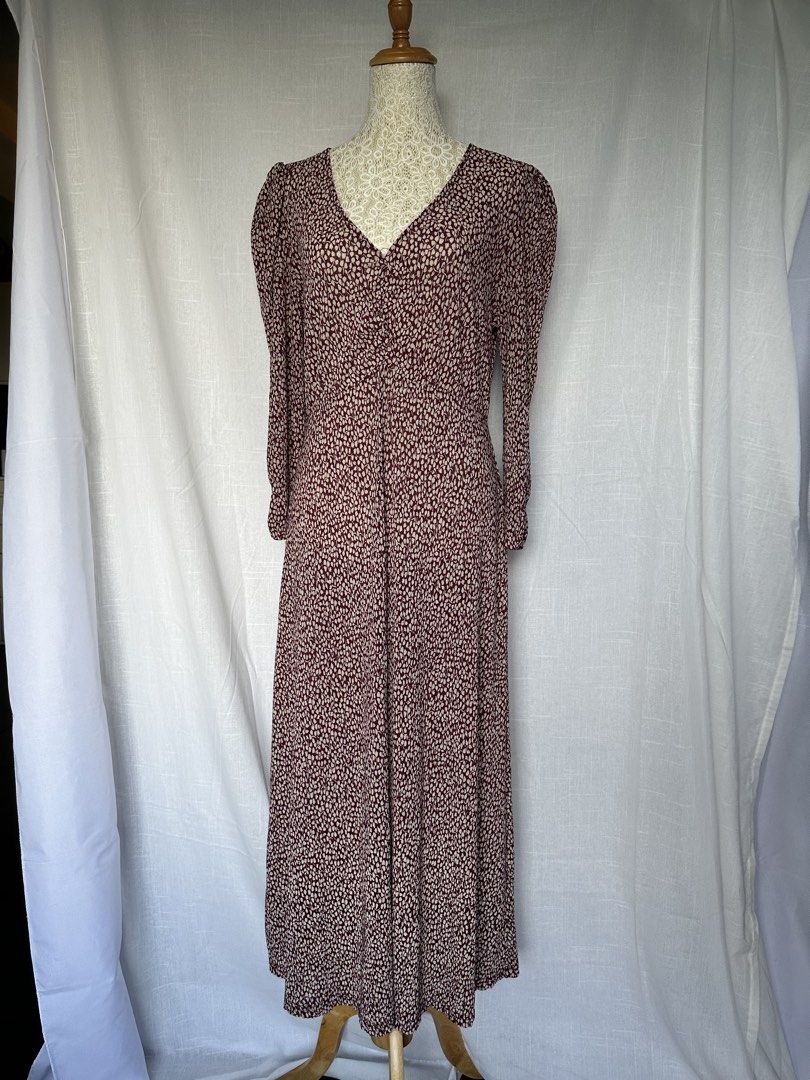 MANGO V-Neck Midi Dress with Puff Sleeves (Category: Dresses) located in Lapu Lapu. Submitted by pangayamph (Listing ID 1445472147, Image 2). Description: MANGO - Maroon midi dress with all-over floral print - Flattering V-neckline - Elegant puff sleeves - Cinched waist for a defined silhouette - Perfect for dressing up or down, suitable for any occasion.