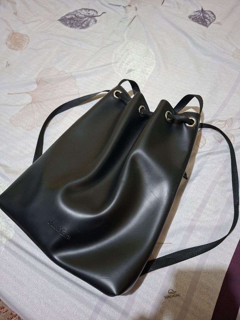 Max Mara Black Drawstring Bucket Bag Backpack (Category: Backpacks) located in Taguig. Submitted by dafashionph (Listing ID 1445569389, Image 1). Description: Authentic Max Mara Drawstring Bucket Bag / Backpack 🖤 Selling this sleek, minimalist Max Mara bag. Super versatile piece that works perfectly as a daily casual backpack or a trendy drawstring bucket bag! ✨ FEATURES: • Brand: Max Mara (Authentic VIP Gift with Purchase / Parfums line) • Colo