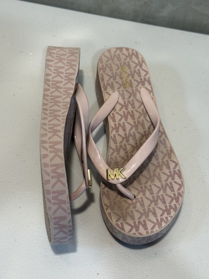 Michael Kors MK Logo Wedge Flip Flops Pink (Category: Slippers and slides) located in Calamba. Submitted by jheckitz (Listing ID 1445536548, Image 1). Description: MICHAEL KORS Bedford MK Signature Ballet Pink Wedges Flip-Flops Super ganda ng color😭 SIZE: 23 - 23.5cm Lalamove or J&T Express.