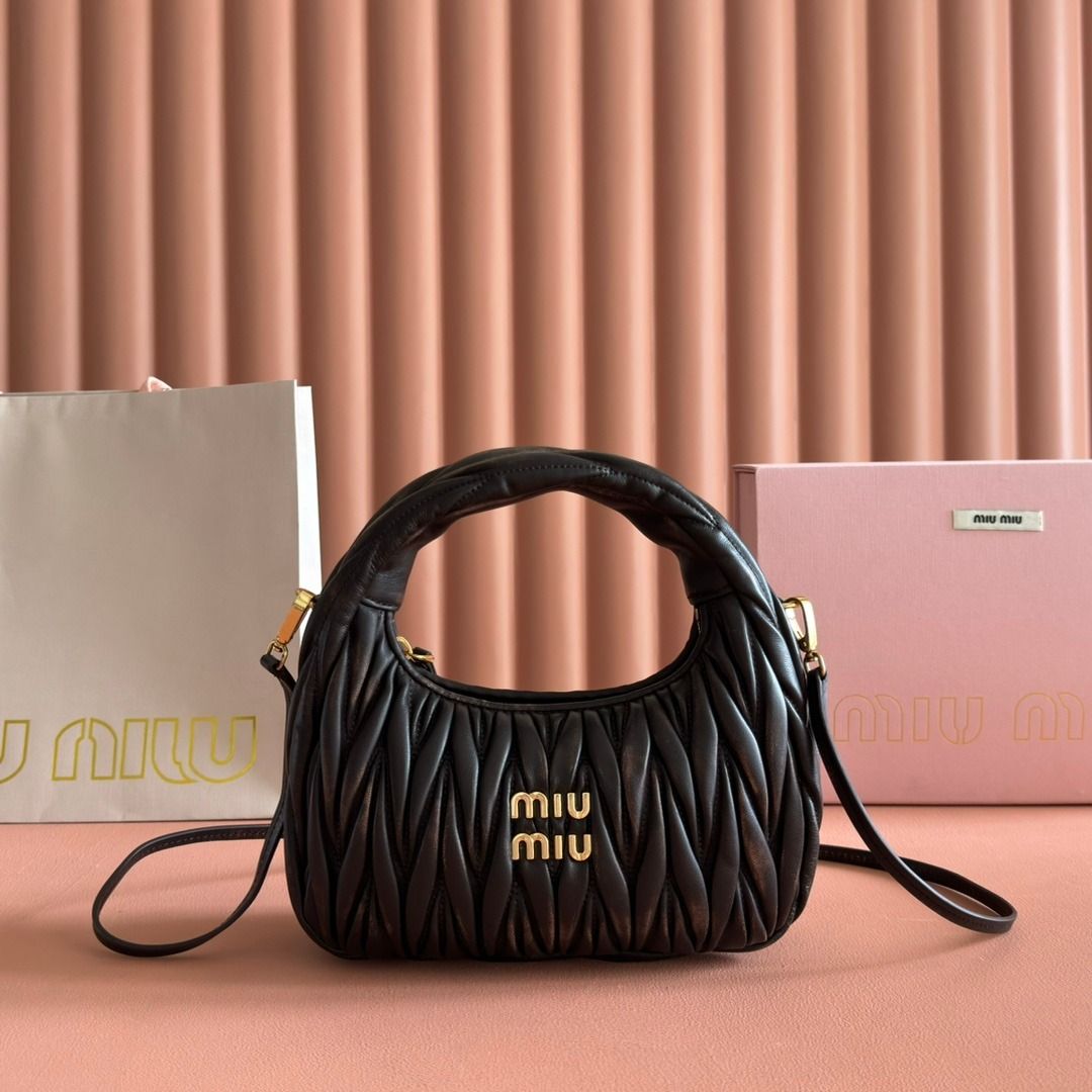 Miu Miu Black Matelassé Mini Bag (Category: Luxury Bags & Wallets) located in Muntinlupa City. Submitted by sunstoneglow5116882 (Listing ID 1445496191, Image 1). Description: - Authentic Miu Miu mini bag - Signature matelassé leather - Top handle - Detachable shoulder strap - Gold-tone hardware - Includes dust bag and box - Ideal for evenings or adding chicness to any outfit.
