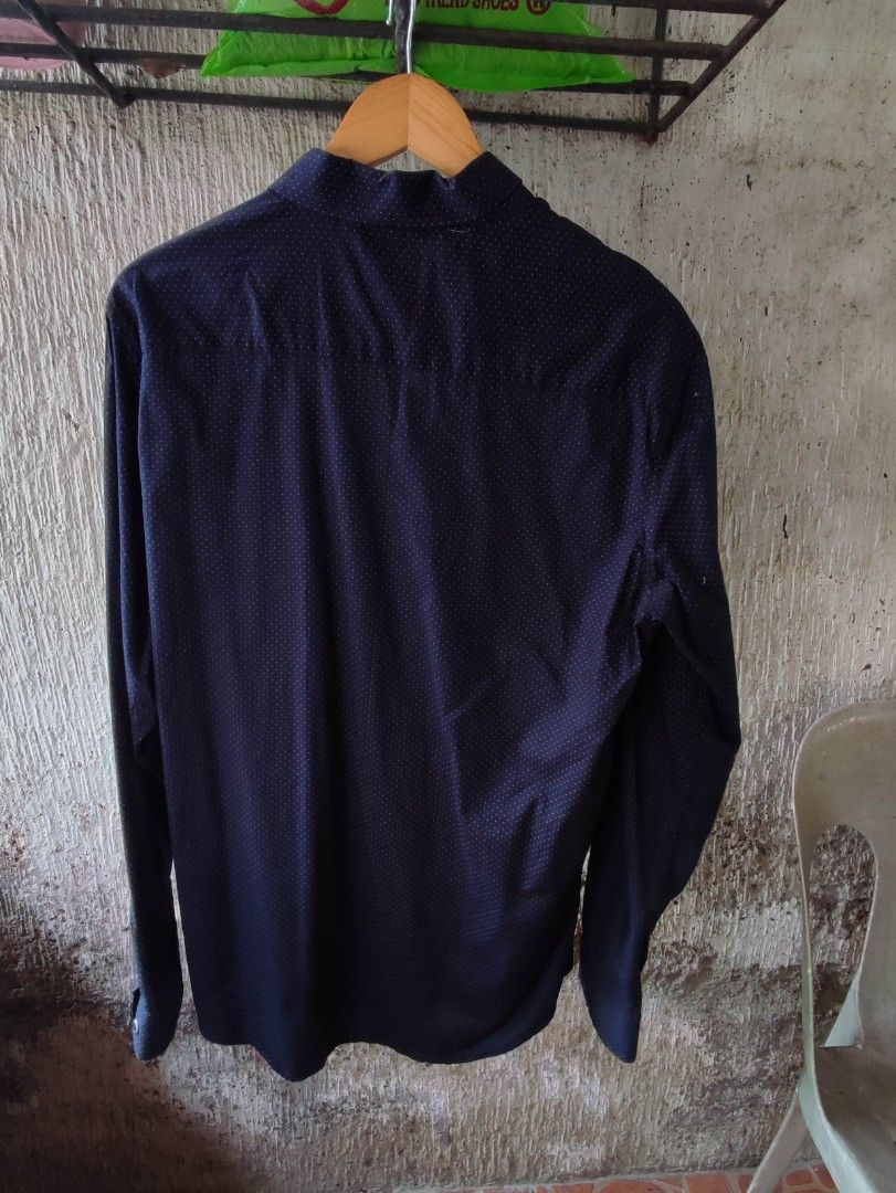 Navy Blue Polka Dot Long Sleeve Shirt (Category: Tshirts & Polo Shirts ) located in Mangaldan. Submitted by michelle_2004 (Listing ID 1445444259, Image 2). Description: - Navy blue long sleeve shirt - Subtle white polka dot pattern - Button-up front - Chest pocket - Button details on cuffs - Versatile for casual or smart casual outfits.