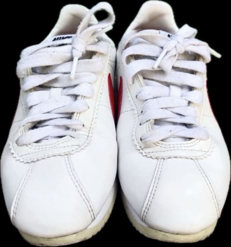 Nike Cortez White Red Blue Leather Sneakers (Category: Sneakers) located in Cebu City. Submitted by lucypim (Listing ID 1445446301, Image 3). Description: - Iconic Nike Cortez sneakers - Color: White leather with red swoosh and heel tab - Features a blue stripe on the midsole - Origin: Made in Vietnam - Ideal for everyday wear - Grab these classic kicks!.