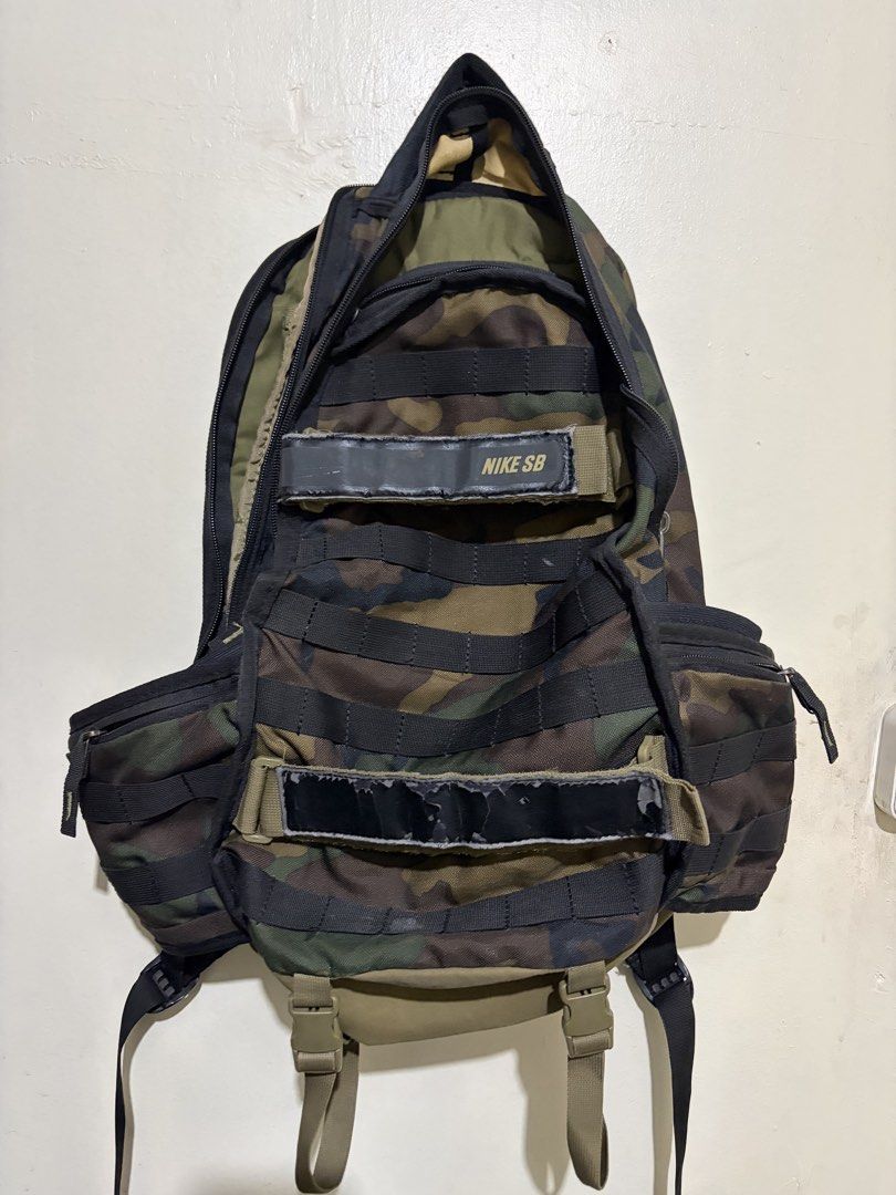 Nike SB RPM Camo Backpack 29 liter (Category: Backpacks) located in Manila. Submitted by wiseearth.075b2f (Listing ID 1445548068, Image 2). Description: - Nike SB RPM Backpack camou -₱2575 -issue crack paint lang yung black the rest is excellent condition -100% legit - Stylish camouflage pattern - Multiple pockets for organization - Straps for carrying extra gear - Ideal for school or skateboarding.