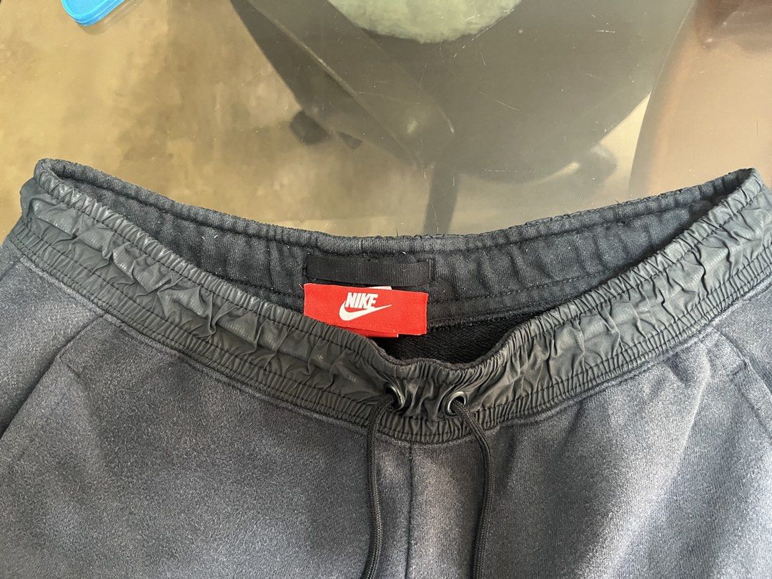 Nike Tech Fleece Joggers in Black (Category: Joggers) located in Manila. Submitted by neloluu (Listing ID 1445561458, Image 3). Description: Nike Tech Fleece Joggers - size is in large (L) - has your typical fleece joggers with elastic waistband with drawstring, two side pockets, one back pocket - normal signs of usage, but in good condition - could be for the gym or streetwear style location is in mnl can do lbc.