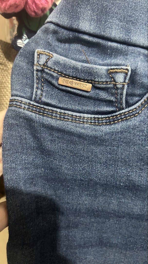 Nine West Blue Denim Jeans (Category: Jeans) located in San Fernando. Submitted by gothclaudiaa (Listing ID 1445600817, Image 2). Description: - Brand: Nine West - Color: Blue Denim - Features: Elastic waistband for comfort, classic five-pocket styling - Detail: Brand logo on front coin pocket - Fit: Straight leg - Occasion: Great for everyday wear.