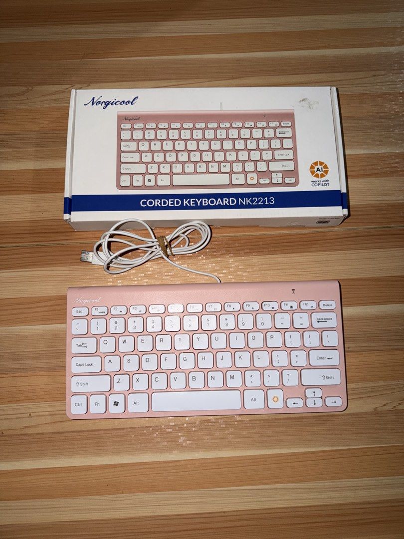 Norgicool NK2213 Corded Keyboard (Category: Computer Keyboard) located in Las Pinas. Submitted by techietechtrove (Listing ID 1445428978, Image 1). Description: Norgicool NK2213 Corded Keyboard Core Specifications: Design: Compact “chocolate” style keys with an easy-to-read, familiar minimal layout. Connectivity: Wired USB (plug-and-play, no setup required). Cable Length: 1.5 meters. Key Features: Dedicated AI hotkey for Copilot, along with funct
