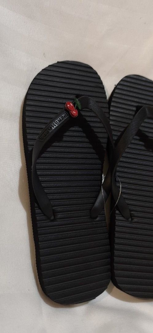 Penshoppe Black Flip-flops with Cherry Charms (Category: Slippers and slides) located in Malabon City. Submitted by ph_ohkaye (Listing ID 1445537130, Image 2). Description: - Classic black flip-flops - Adorable cherry charms on straps - Simple and versatile design - Ideal for casual wear, beach, or lounging - Easy slip-on style -size 7 .