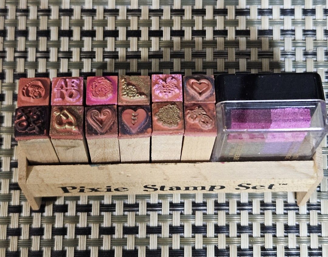 Pixie Stamp Set with Ink Pad (Category: Craft Supplies & Tools) located in Rizal. Submitted by cherry_garcia (Listing ID 1445536342, Image 3). Description: - Pixie Stamp Set with wooden holder - Features various designs like hearts and flowers - Includes 'Personal Stamp Exchange' ink pad - 4 ink colors: pink, purple, blue, and green - Ideal for crafting and scrapbooking projects.