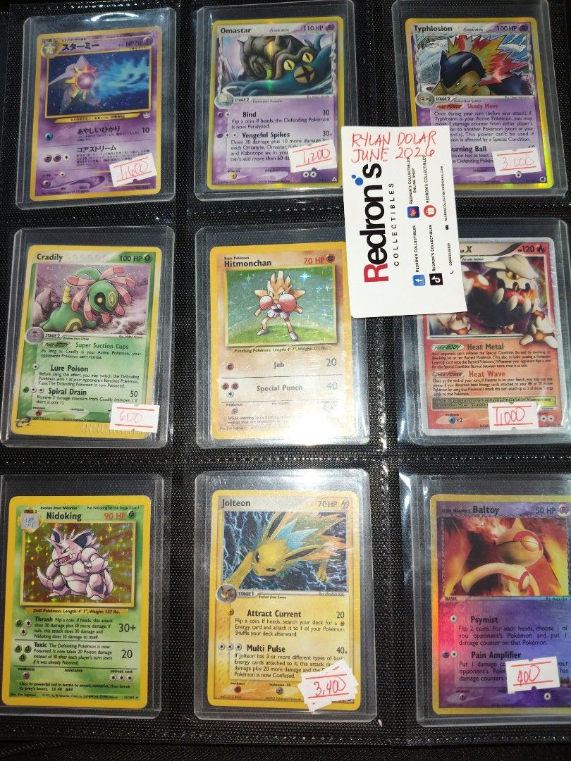 Pokemon Cards For Sale Assorted in Toploader Binder (Category: Raw Singles) located in Manila. Submitted by redron.dolarrylan (Listing ID 1445605662, Image 2). Description: - Collection of Pokemon cards for sale. - Some cards are holographic, adding rarity and value. - Prices are clearly marked on each card in the provided photos. - Ideal for both dedicated collectors and active players. - Feel free to ask any questions about specific cards. - Do