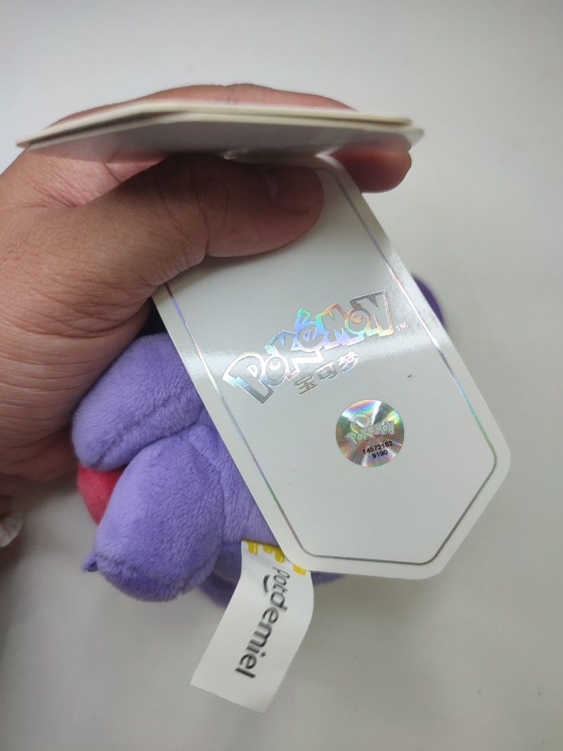 Pokemon Gengar Plush Keychain with Heart (Category: Plushies & Soft Toys) located in Manila. Submitted by epicmountain-f20453 (Listing ID 1445463178, Image 2). Description: - Adorable Gengar plush keychain - Features a cute pink heart design - Comes with a sturdy purple clip for bags or keys - Brand new with original tags attached - A must-have for any Pokemon collector.