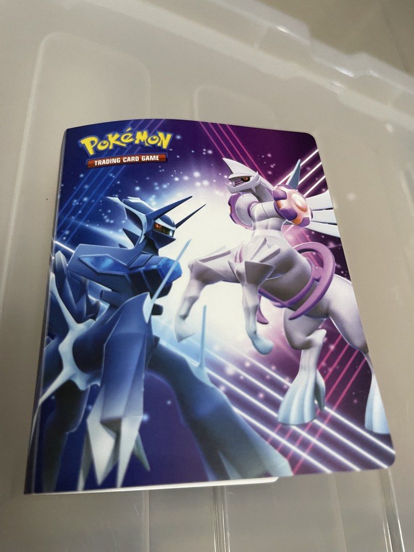 Pokemon Trading Card Binder with Minecraft Cards (Category: Raw Singles) located in Quezon City. Submitted by jaedenry0228 (Listing ID 1445451325, Image 1). Description: - Pokemon trading card binder featuring a cool Dialga and Palkia cover. - Comes with several Minecraft trading cards. - Cards are from McDonald's and have a shiny, holographic finish. - Ideal for collectors looking to add to their collection..