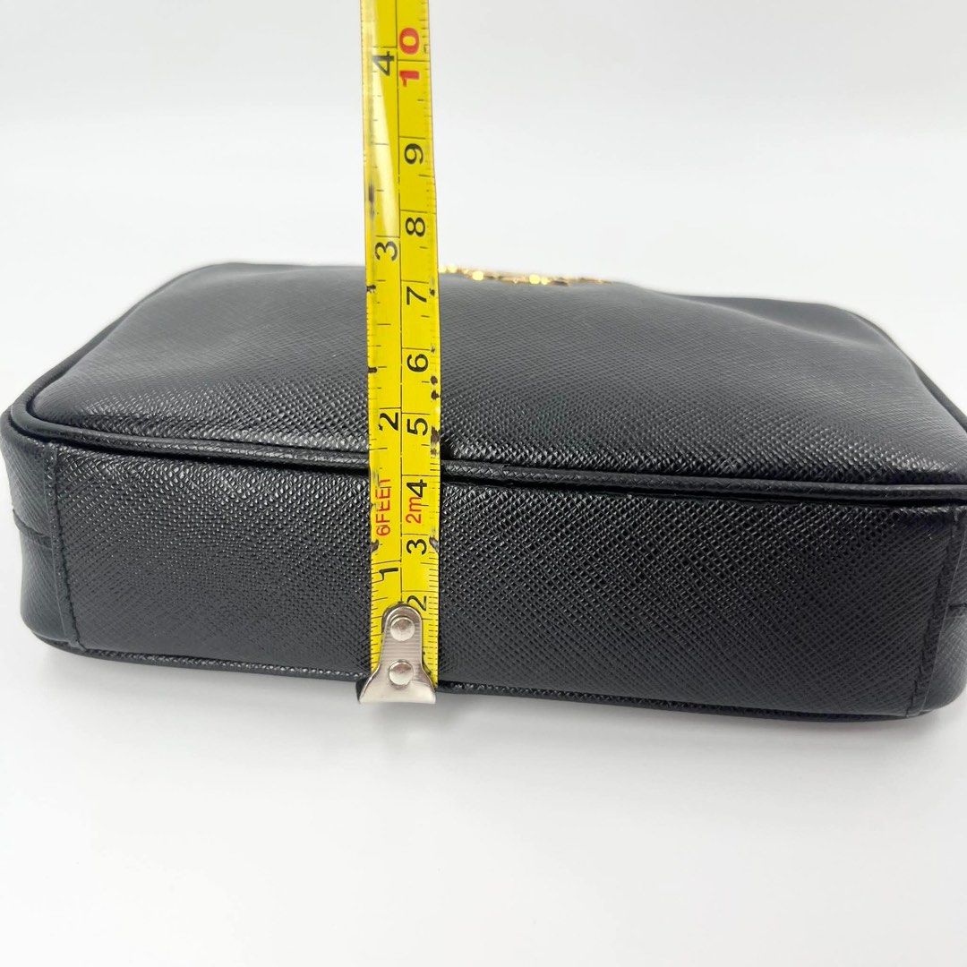 Prada Saffiano Leather Camera Bag Black Gold Hardware (Category: Luxury Bags & Wallets) located in Manila. Submitted by missgrace_collection (Listing ID 1445513424, Image 2). Description: - Classic black Prada camera bag - Genuine Saffiano leather - Elegant gold hardware details - Adjustable strap for comfort - Spacious enough for phone and essentials - Versatile for everyday or evening use - Immaculate interior condition - Approximate dimensions