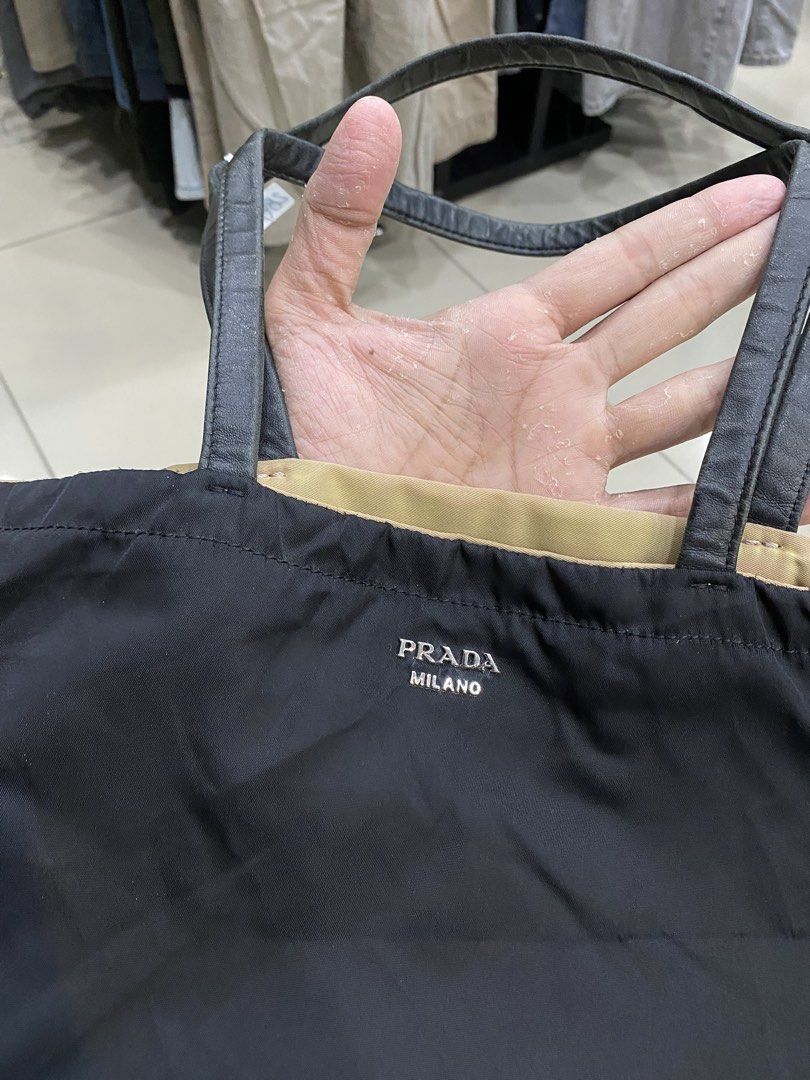 Prada Tessuto Nylon Tote Bag (Category: Luxury Bags & Wallets) located in Legazpi City. Submitted by folksfave (Listing ID 1445427874, Image 3). Description: Rank AB Working zip 9/10 color rate Canvas and leather material are in good Presentable .