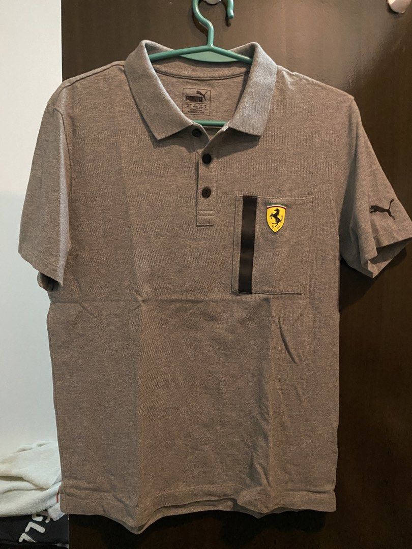 Puma Ferrari Grey Polo Shirt (Category: Tshirts & Polo Shirts ) located in Manila. Submitted by humbee07 (Listing ID 1445467496, Image 1). Description: - Authentic Grey Puma x Ferrari Polo Shirt - Size: S - Features iconic Ferrari shield logo on chest - Puma logo on sleeve.