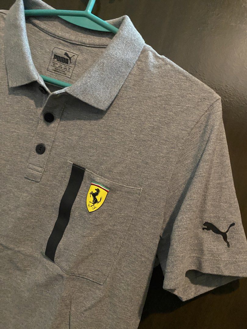Puma Ferrari Grey Polo Shirt (Category: Tshirts & Polo Shirts ) located in Manila. Submitted by humbee07 (Listing ID 1445467496, Image 2). Description: - Authentic Grey Puma x Ferrari Polo Shirt - Size: S - Features iconic Ferrari shield logo on chest - Puma logo on sleeve.