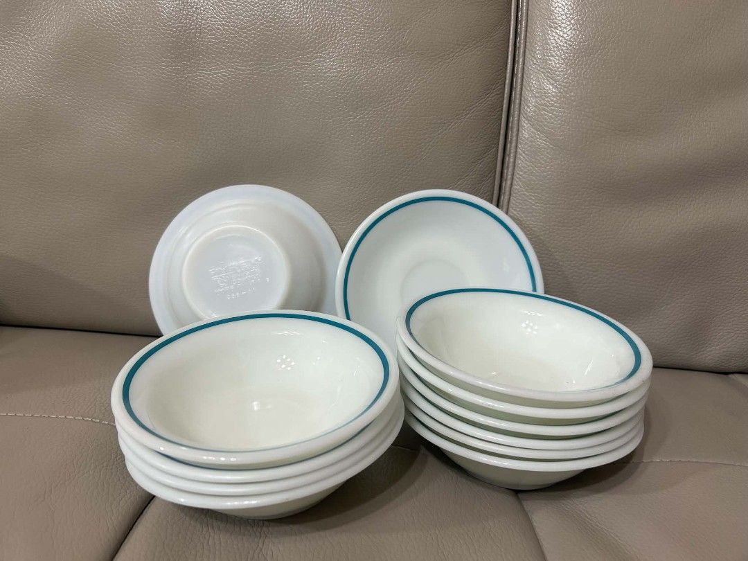 PYREX Dinnerware Set - Blue & Green Trim (Category: Dinnerware & Cutlery) located in Cebu City. Submitted by mjuntilla (Listing ID 1445428983, Image 2). Description: - Complete pytex dinnerware set - Includes plates and bowls with blue and green trim - Features cups and saucers with a green leaf pattern - Some pieces have a simple blue stripe design - Versatile for everyday meals or special gatherings - Perfect for mixing and matching styles.
