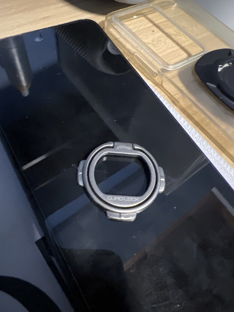 Quad Lock Phone Ring Holder Stand (Category: Mounts & Holders) located in Quezon City. Submitted by declutter2022_ (Listing ID 1445570320, Image 1). Description: - Quad Lock phone ring holder - Attaches securely to the back of your phone or case - Functions as a convenient stand for hands-free video watching - Enhances your grip for better phone handling - Compatible with magnetic car mounts for easy in-car use - A versatile and essential phone a