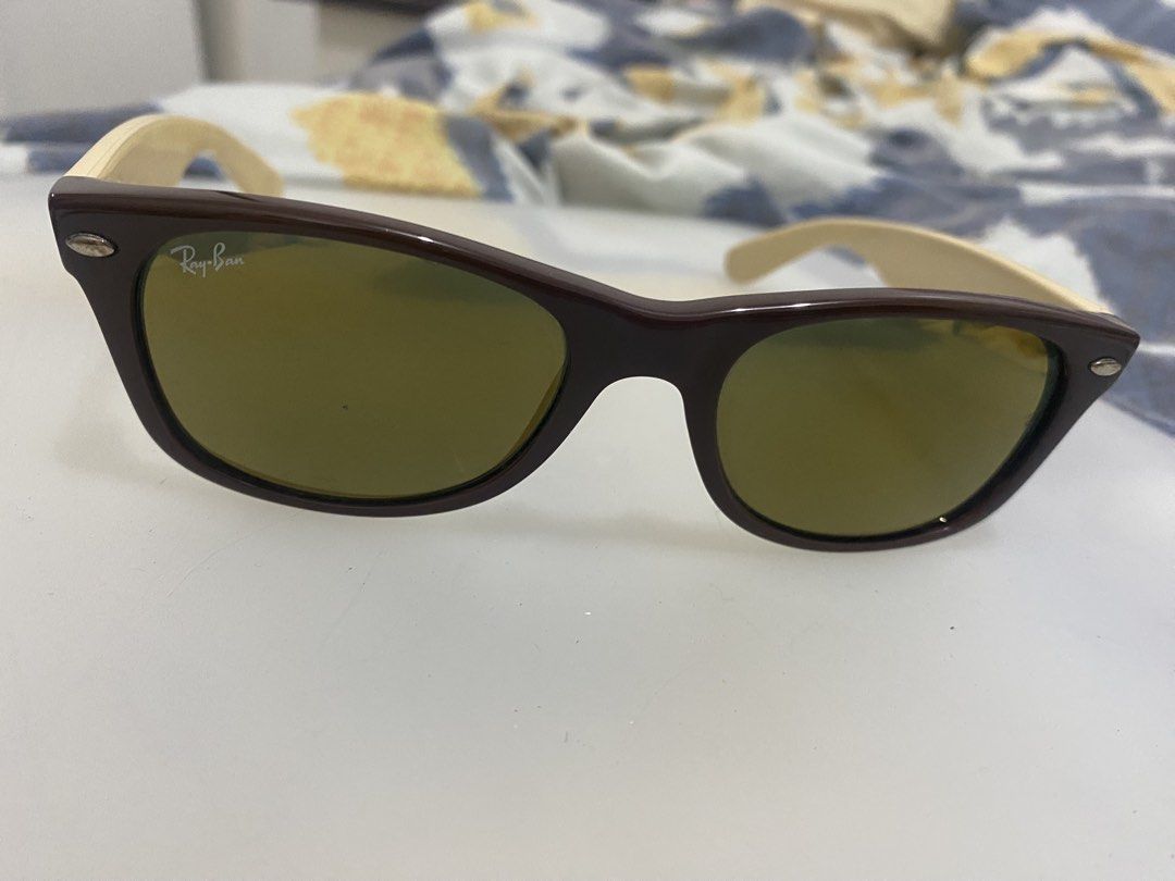 Ray-Ban Wayfarer Sunglasses Brown Frame (Category: Sunglasses & Eyewear) located in Quezon City. Submitted by iam3871 (Listing ID 1445579139, Image 3). Description: - Classic Ray-Ban Wayfarer sunglasses - Brown frame with light brown arms - Tinted lenses - Perfect for everyday wear - Features Ray-Ban logo on the side - A stylish accessory.