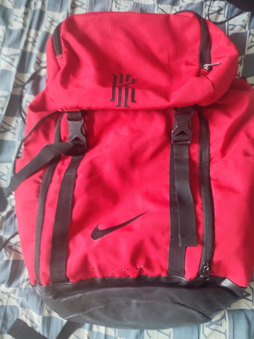 Red Nike Backpack with Kyrie Logo (Category: Backpacks) located in Sorsogon. Submitted by sergioslyughsome (Listing ID 1445427026, Image 1). Description: - Red Nike backpack featuring the iconic Kyrie logo on the top flap. - Stylish black accents and comfortable adjustable straps. - Multiple pockets for organized storage. - Durable material built to last. - Ideal for school, gym, or everyday adventures..