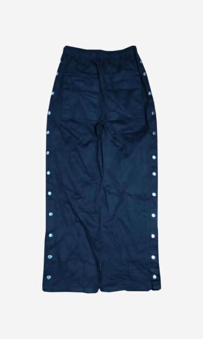 RICK OWENS DRKSHDW (Category: Joggers) located in Manila. Submitted by good2thrift (Listing ID 1445440890, Image 2). Description: RICK OWENS DRKSHDW BLACK PUSHER PANTS SIZE LENGTH 40.5 WIDTH 36 STRECHABLE LEG 11 - These pusher pants are floor length with a wide leg and a slightly dropped crotch. They have an elasticized waistband with drawstring, side front jet pockets and square back pockets with flaps and topstitching. They feature visible snap