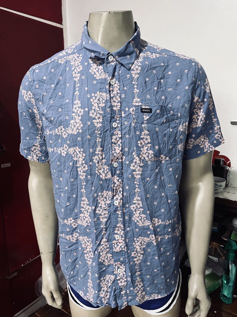 RVCA Loom Short Sleeve Shirt (Category: Formal Shirts) located in Quezon City. Submitted by wacpon_061972 (Listing ID 1445517292, Image 1). Description: This is a blue and pink RVCA Loom Short Sleeve Shirt featuring a floral pattern. (W-23/L-30).