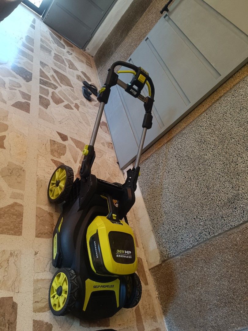 Ryobi 36V Lithium 4Ah Battery Powered Lawn Mower (Category: Construction Tools & Equipment) located in Tarlac. Submitted by ibrahimharb81 (Listing ID 1445540937, Image 2). Description: - Ryobi 36V Lawn Mower - Brushless Motor - Self-Propelled for easy mowing - Includes 36V Lithium 4Ah Battery and Charger - Ideal for small to medium-sized yards - Easy to maneuver and operate - Achieve a sharp, well-maintained lawn location tarlac city for pick up 