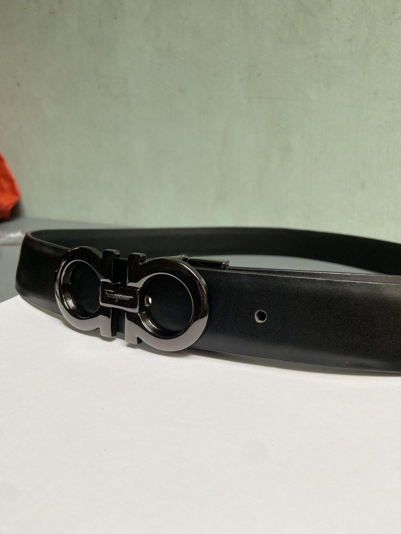 Salvatore Ferragamo Gancini Belt (Category: Belts) located in Manila. Submitted by adriyawnnn (Listing ID 1445511485, Image 2). Description: - Genuine black leather belt - Iconic Gancini buckle with gunmetal finish - Classic and versatile design - Suitable for both formal and casual wear - Shows minimal signs of wear.