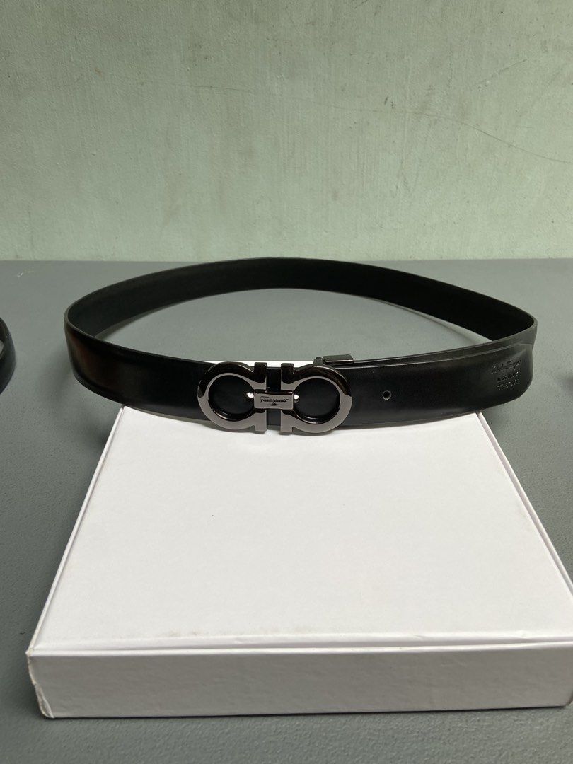 Salvatore Ferragamo Gancini Belt (Category: Belts) located in Manila. Submitted by adriyawnnn (Listing ID 1445511485, Image 1). Description: - Genuine black leather belt - Iconic Gancini buckle with gunmetal finish - Classic and versatile design - Suitable for both formal and casual wear - Shows minimal signs of wear.