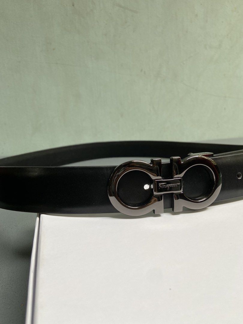 Salvatore Ferragamo Gancini Belt (Category: Belts) located in Manila. Submitted by adriyawnnn (Listing ID 1445511485, Image 3). Description: - Genuine black leather belt - Iconic Gancini buckle with gunmetal finish - Classic and versatile design - Suitable for both formal and casual wear - Shows minimal signs of wear.