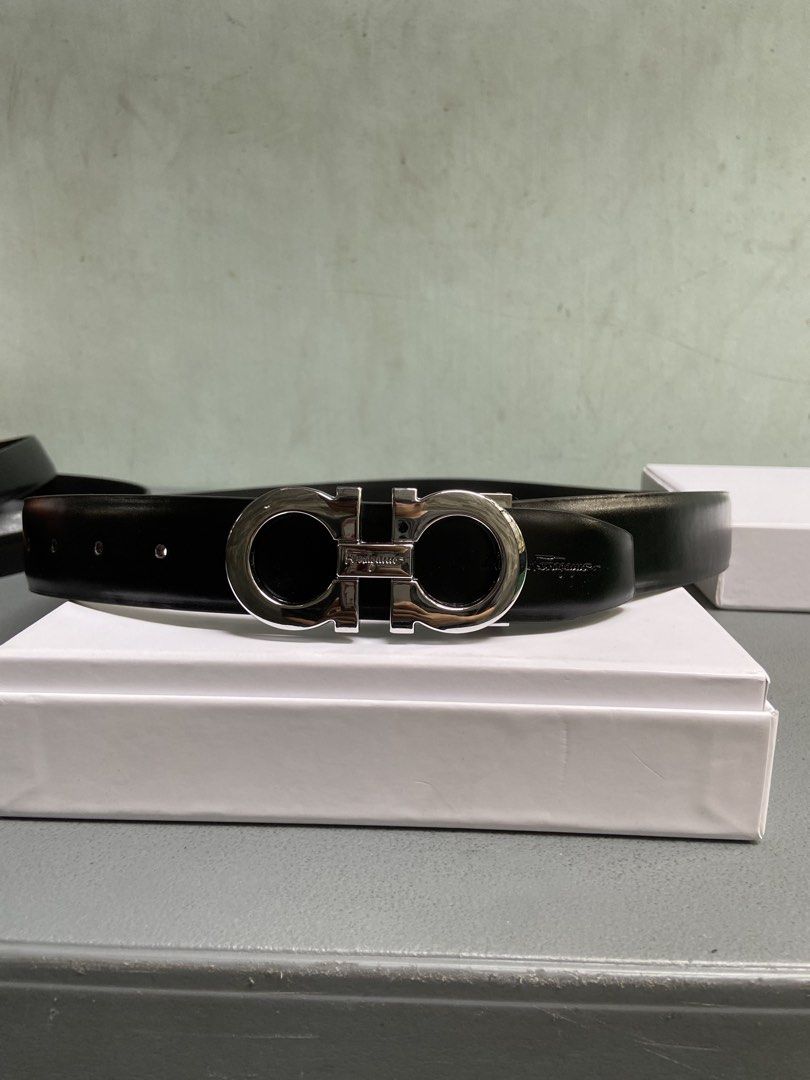Salvatore Ferragamo Gancini Belt (Category: Belts) located in Manila. Submitted by adriyawnnn (Listing ID 1445511841, Image 2). Description: - Classic black leather belt - Iconic silver-tone Gancini buckle - Versatile accessory, pairs with any outfit - Detailed photos of buckle available - Feel free to ask questions.