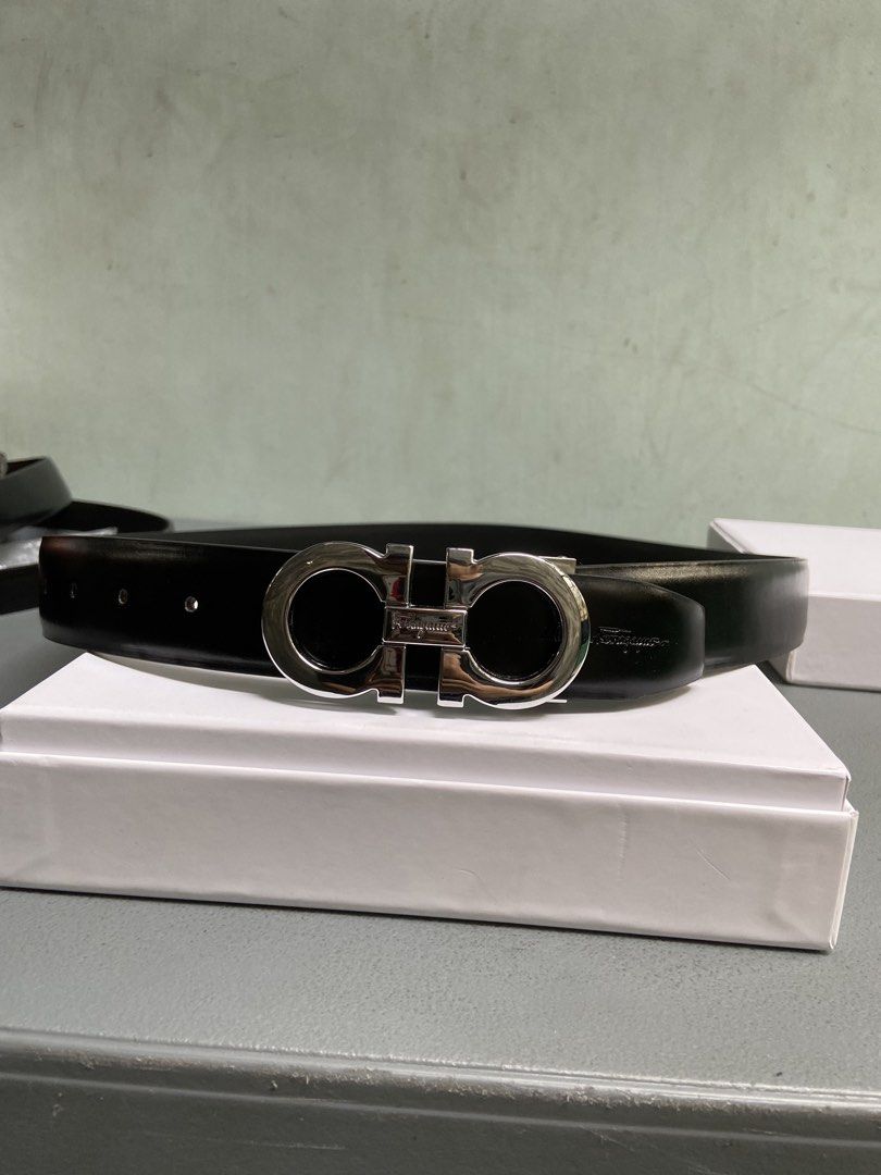 Salvatore Ferragamo Gancini Belt (Category: Belts) located in Manila. Submitted by adriyawnnn (Listing ID 1445511841, Image 3). Description: - Classic black leather belt - Iconic silver-tone Gancini buckle - Versatile accessory, pairs with any outfit - Detailed photos of buckle available - Feel free to ask questions.