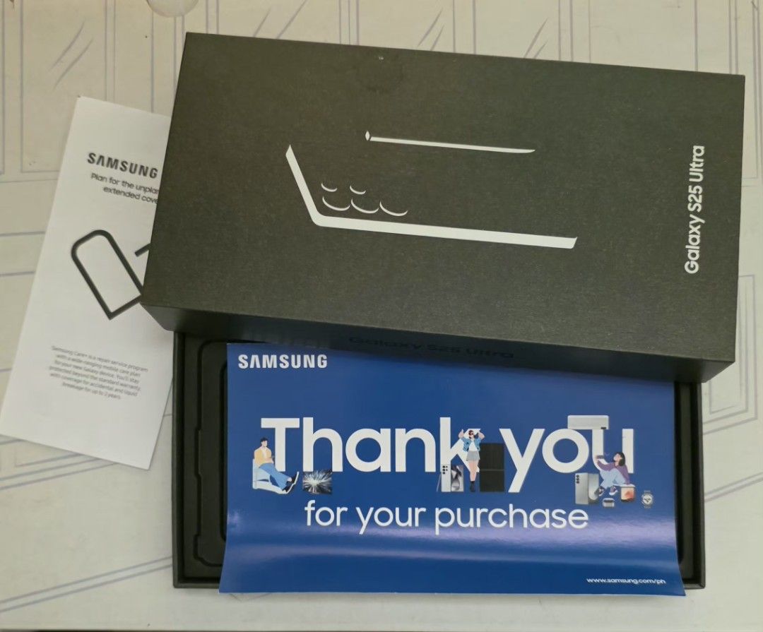 Samsung Galaxy S25 Ultra (Category: Samsung) located in Quezon City. Submitted by unida.fabian (Listing ID 1445496887, Image 1). Description: - Samsung Galaxy S25 Ultra - Includes original box and thank you card - Impressive rear camera setup - Network and phone details visible in 'About phone' section.
