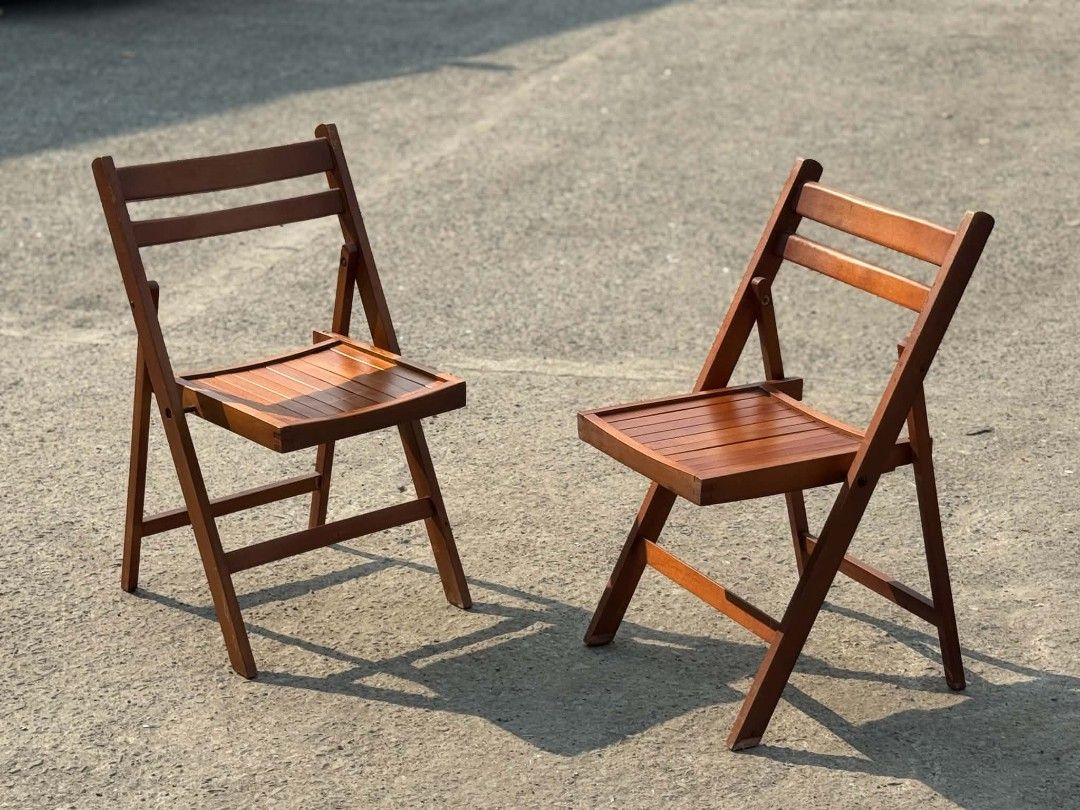 Set of 2 Wooden Folding Chairs (Category: Chairs) located in Valenzuela. Submitted by upcycle_things (Listing ID 1445462821, Image 2). Description: - Set of 2 wooden folding chairs - Features a nice wood finish - Slatted seat and backrest for comfort - Foldable design for easy storage and transport - Perfect for extra seating.