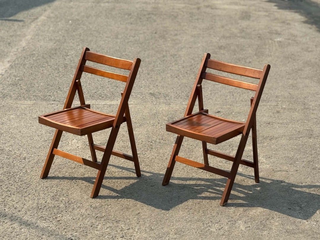 Set of 2 Wooden Folding Chairs (Category: Chairs) located in Valenzuela. Submitted by upcycle_things (Listing ID 1445462821, Image 1). Description: - Set of 2 wooden folding chairs - Features a nice wood finish - Slatted seat and backrest for comfort - Foldable design for easy storage and transport - Perfect for extra seating.