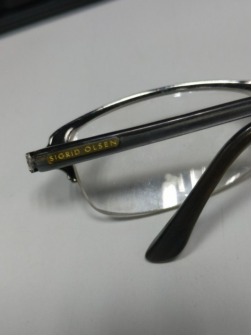 Sigrid Olsen Eyeglasses - Metal Half-Rim Frame (Category: Sunglasses & Eyewear) located in Manila. Submitted by bigtym.picker (Listing ID 1445484024, Image 3). Description: Price - 500 PESOS ONLY REPLACEABLE LENS PLS SEE PIC FOR DETAILS. Selling all items AS IS PLS. manage your Expectation We accept shipping nationwide Meetup - BACOOR or near MOA - Brand: Sigrid Olsen - Frame Type: Metal, Half-Rim - Arm Finish: Dark Grey - Temple Detail: Subtle d