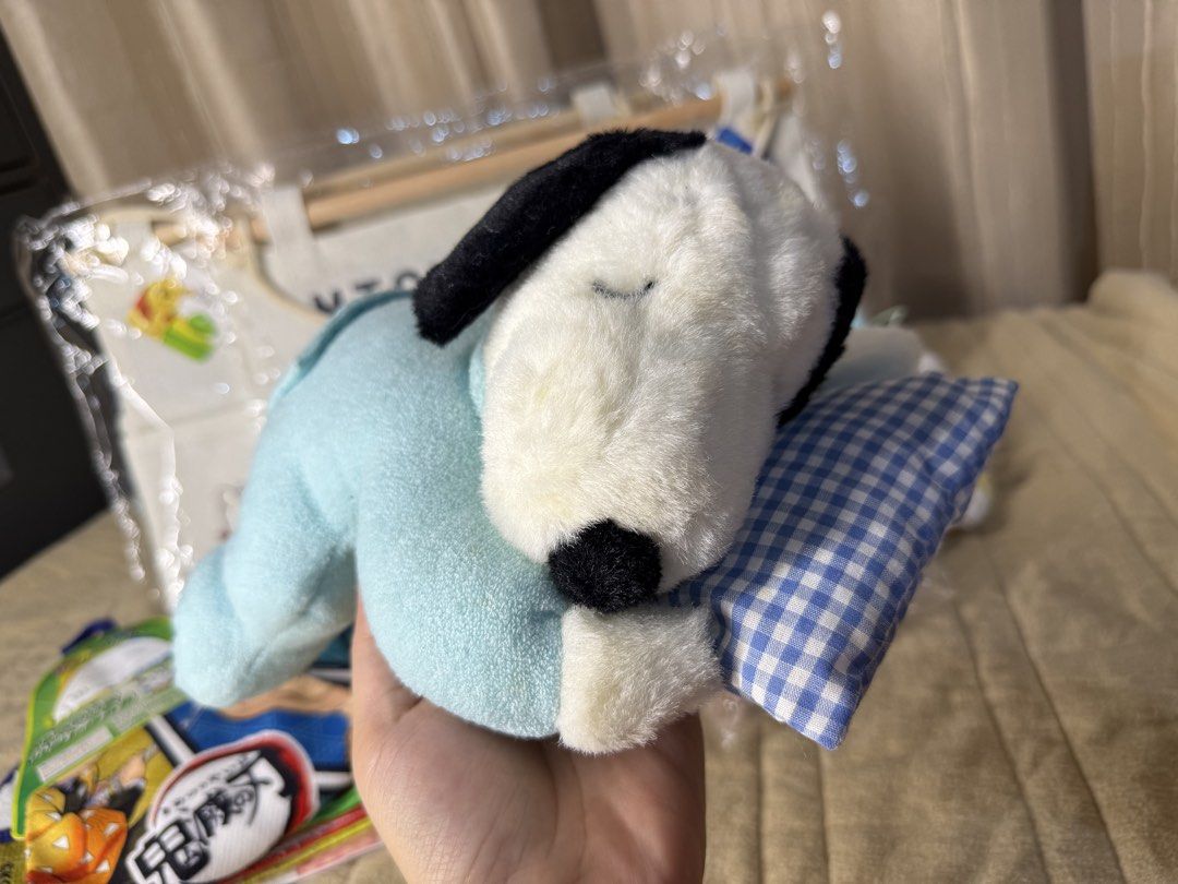 Sleeping Snoopy Dog Plush Toy with Pillow (Category: Plushies & Soft Toys) located in Valenzuela. Submitted by missp22 (Listing ID 1445489752, Image 1). Description: - Adorable plush toy resembling Snoopy, the sleeping dog. - Comes dressed in cute light blue pajamas. - Includes a small checkered pillow for extra charm. - Made with soft and cuddly material, perfect for hugs. - Ideal for collectors or as a delightful decor piece. - Packaging is inc