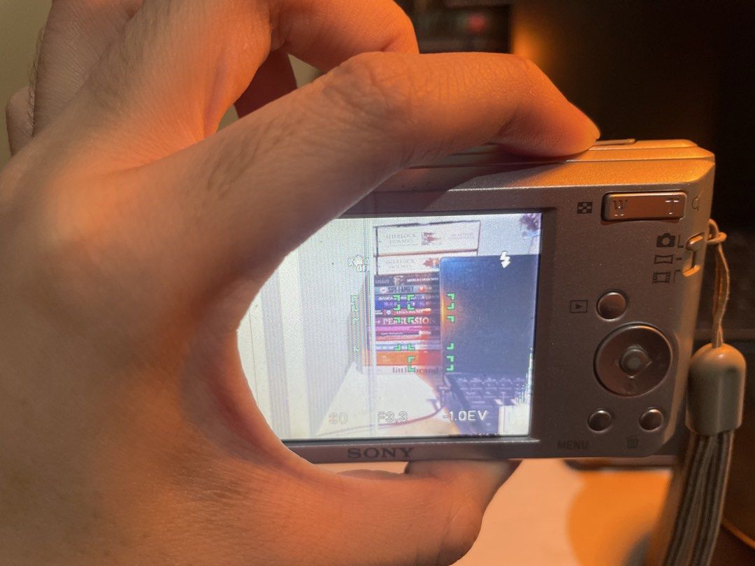 Sony Cyber-shot 14.1MP Digital Camera (Category: Cameras) located in Iligan City. Submitted by maumiikay (Listing ID 1445493730, Image 2). Description: - Sony Cyber-shot digital camera - 14.1 megapixels - 5x optical zoom - Screen has display issues (LCD only— does not affect output) - Sold as is, ideal for parts or repair - good flash -free strap -battery still good ADD 230 for orig sony charger (since i bought it separately) Issues: 1.) Display 