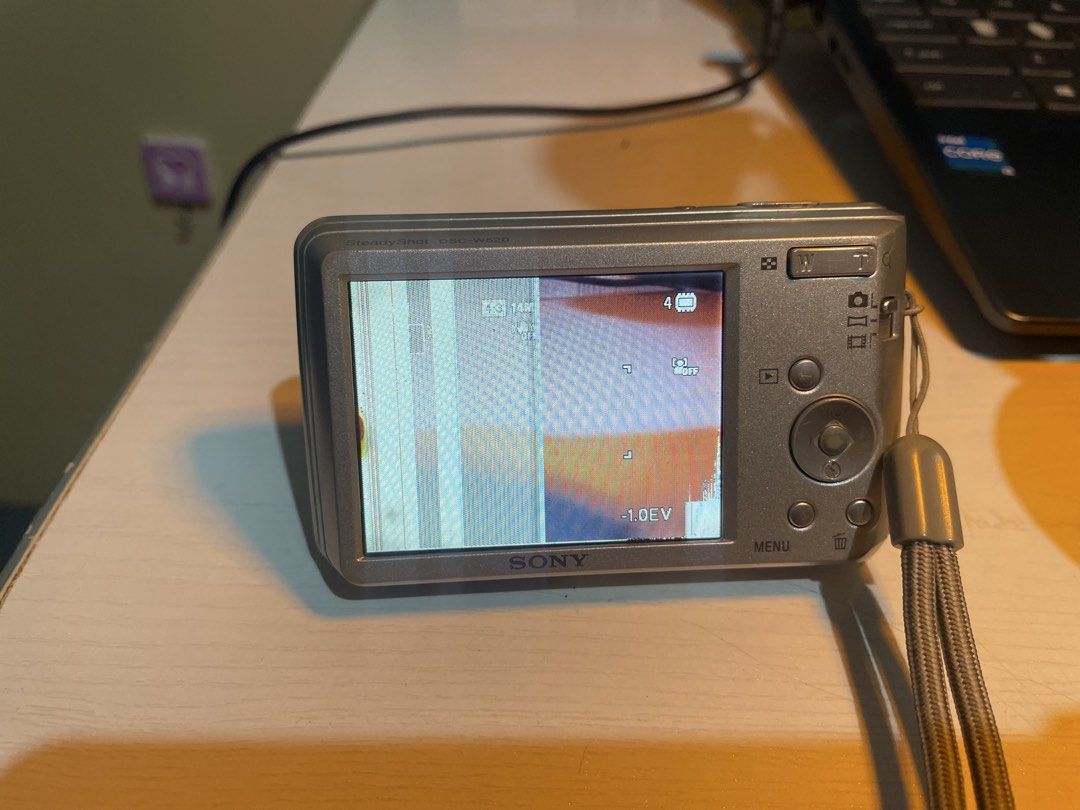 Sony Cyber-shot 14.1MP Digital Camera (Category: Cameras) located in Iligan City. Submitted by maumiikay (Listing ID 1445493730, Image 3). Description: - Sony Cyber-shot digital camera - 14.1 megapixels - 5x optical zoom - Screen has display issues (LCD only— does not affect output) - Sold as is, ideal for parts or repair - good flash -free strap -battery still good ADD 230 for orig sony charger (since i bought it separately) Issues: 1.) Display 