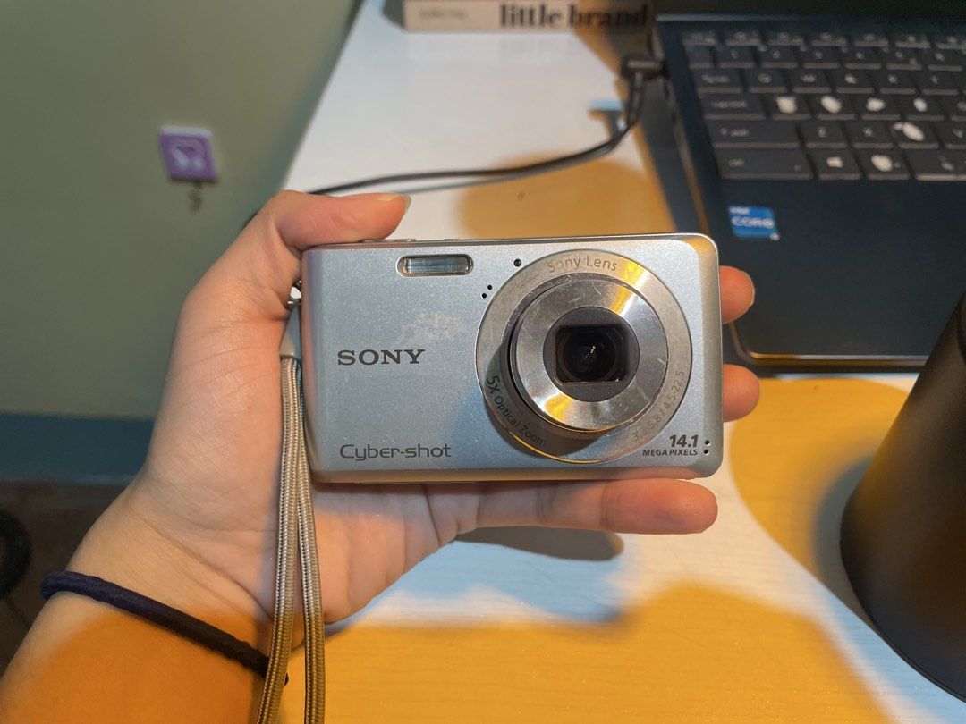 Sony Cyber-shot 14.1MP Digital Camera (Category: Cameras) located in Iligan City. Submitted by maumiikay (Listing ID 1445493730, Image 1). Description: - Sony Cyber-shot digital camera - 14.1 megapixels - 5x optical zoom - Screen has display issues (LCD only— does not affect output) - Sold as is, ideal for parts or repair - good flash -free strap -battery still good ADD 230 for orig sony charger (since i bought it separately) Issues: 1.) Display 
