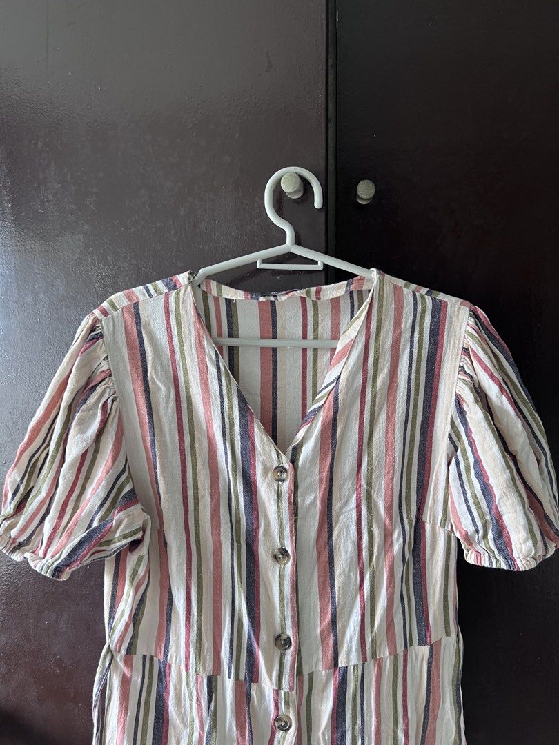 Striped Button-Front Midi Dress with Puff Sleeves (Category: Dresses) located in Quezon City. Submitted by kattykatt (Listing ID 1445437922, Image 2). Description: - Cute striped midi dress - Button-front design - Puff sleeves - Tie at the waist for a cinched look - Colors: Cream, pink, green, and navy stripes - Ideal for casual outings or beach days.