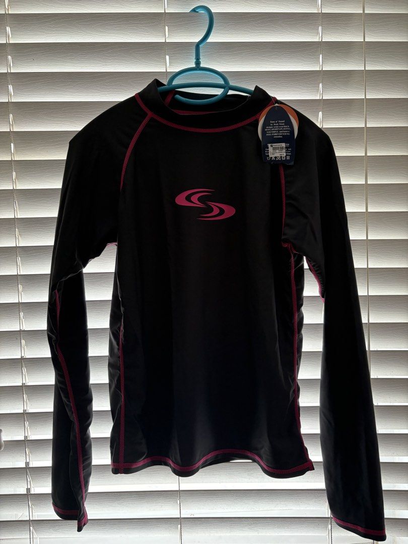 Sun & Sand Long Sleeve Rash Guard Top (Category: Rash guard) located in Antipolo. Submitted by _alyyy_ (Listing ID 1445460564, Image 1). Description: - one for 350, 600 only for bundle Brand: Sun & Sand - Color: Black - Style: Long sleeve rash guard - Features: Pink contrast stitching, Sun & Sand logo on front - Use: Ideal for swimming and sun protection - Condition: Brand new with tag still attached.