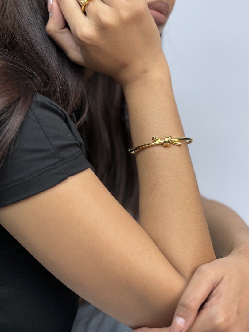 TIFANNY & CO. (Category: Bracelets) located in Angeles City. Submitted by secondluxph (Listing ID 1445582316, Image 2). Description: - TIFANNY & CO - KNOT WIRE BANGLE - YELLOW GOLD PLATED - SIZE 20 - PRISTINE CONDITION FITTED ONLY - JAPAN / HONGKONG SOURCE.