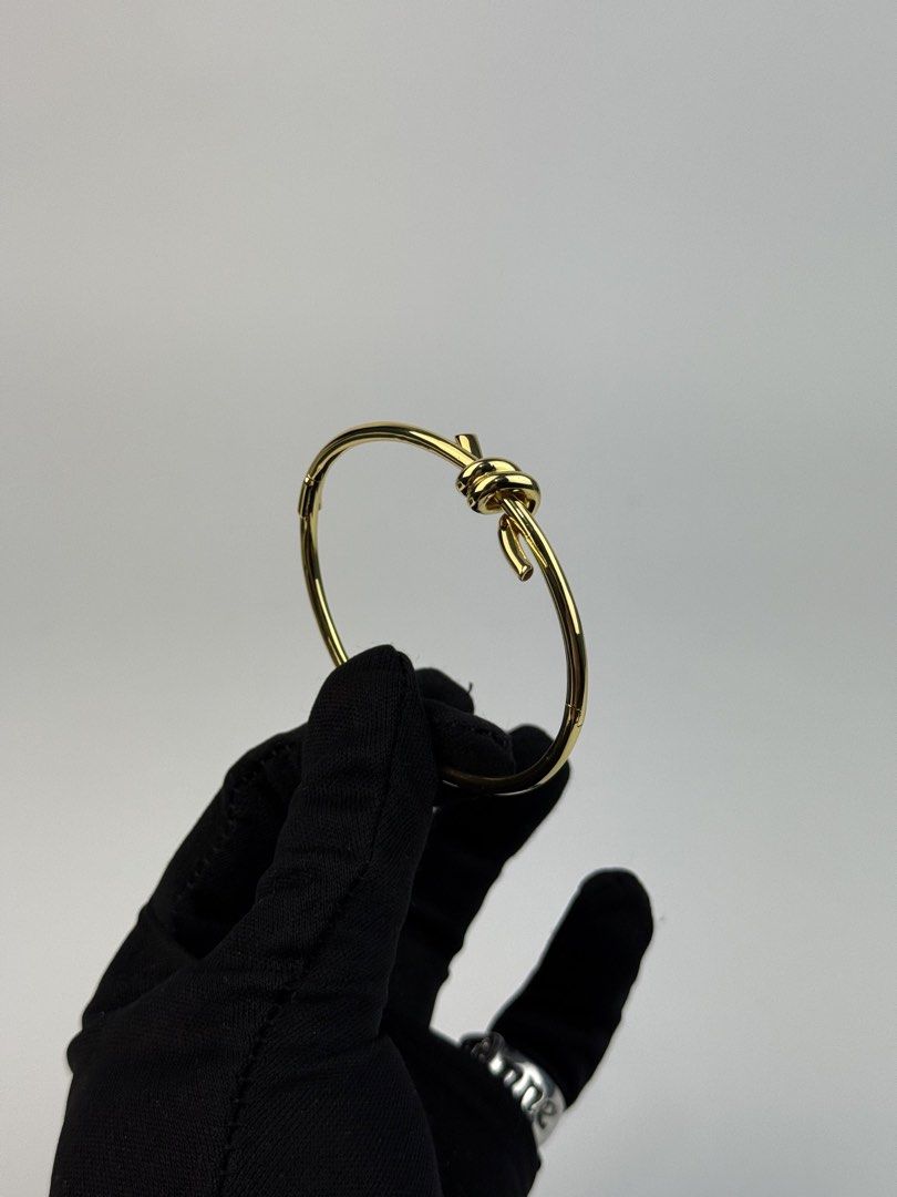 TIFANNY & CO. (Category: Bracelets) located in Angeles City. Submitted by secondluxph (Listing ID 1445582316, Image 1). Description: - TIFANNY & CO - KNOT WIRE BANGLE - YELLOW GOLD PLATED - SIZE 20 - PRISTINE CONDITION FITTED ONLY - JAPAN / HONGKONG SOURCE.