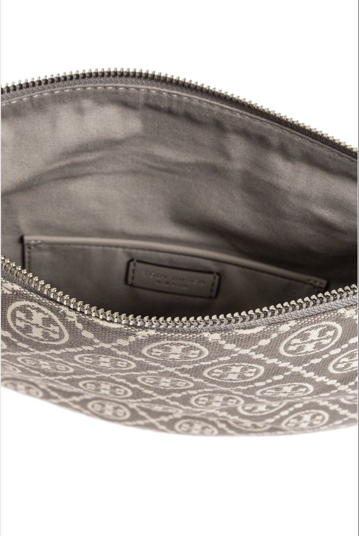 Tory Burch 'T Monogram Small' Shoulder Bag (Category: Luxury Bags & Wallets) located in Santa Cruz. Submitted by imkikay (Listing ID 1445592666, Image 3). Description: - Authentic Tory Burch shoulder bag - Features the iconic T Monogram pattern - Chic half-moon silhouette - Single adjustable strap for comfortable wear - Secure zipper closure - Interior slip pocket for essentials - Ideal for everyday style and convenience - Bought in Milan, Italy 