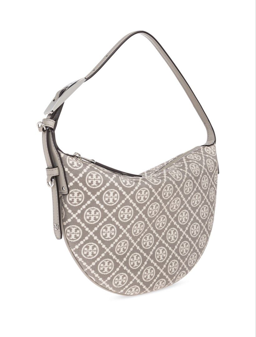 Tory Burch 'T Monogram Small' Shoulder Bag (Category: Luxury Bags & Wallets) located in Santa Cruz. Submitted by imkikay (Listing ID 1445592666, Image 2). Description: - Authentic Tory Burch shoulder bag - Features the iconic T Monogram pattern - Chic half-moon silhouette - Single adjustable strap for comfortable wear - Secure zipper closure - Interior slip pocket for essentials - Ideal for everyday style and convenience - Bought in Milan, Italy 
